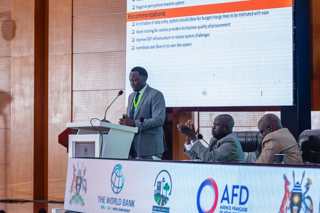 GKMA-UDP Coordinator for Mpigi delivering a presentation on valuing and tracking in-kind and community contributions and, addressing procurement and eGP challenges at the GKMA-UDP Midterm Review.